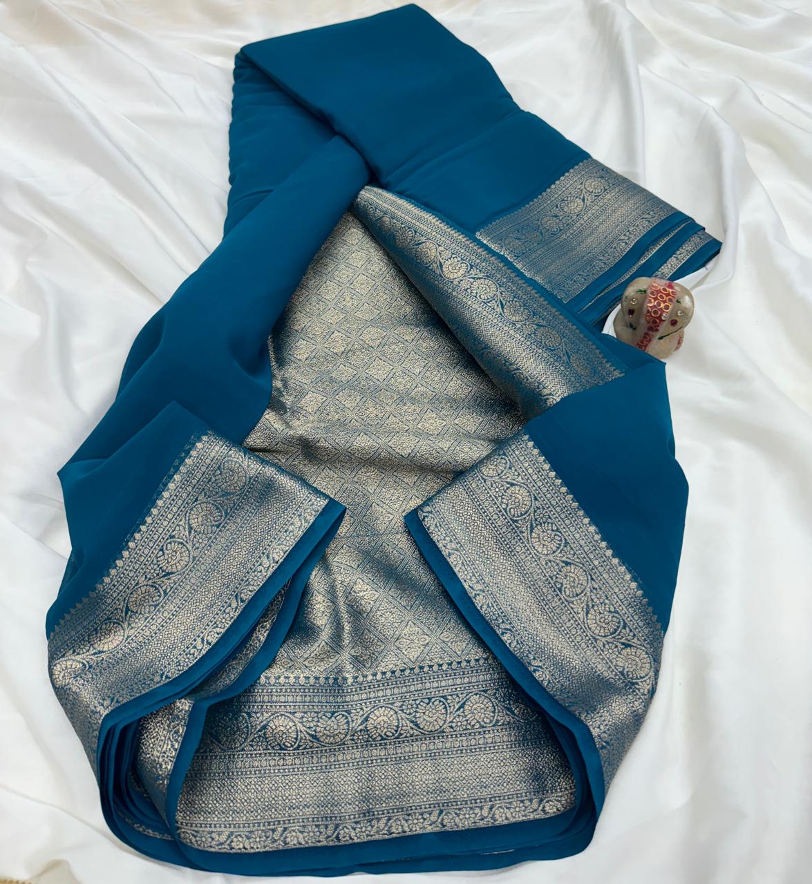 Peacock Blue Pure Khadi Georgette Saree with Silver Contrast Border